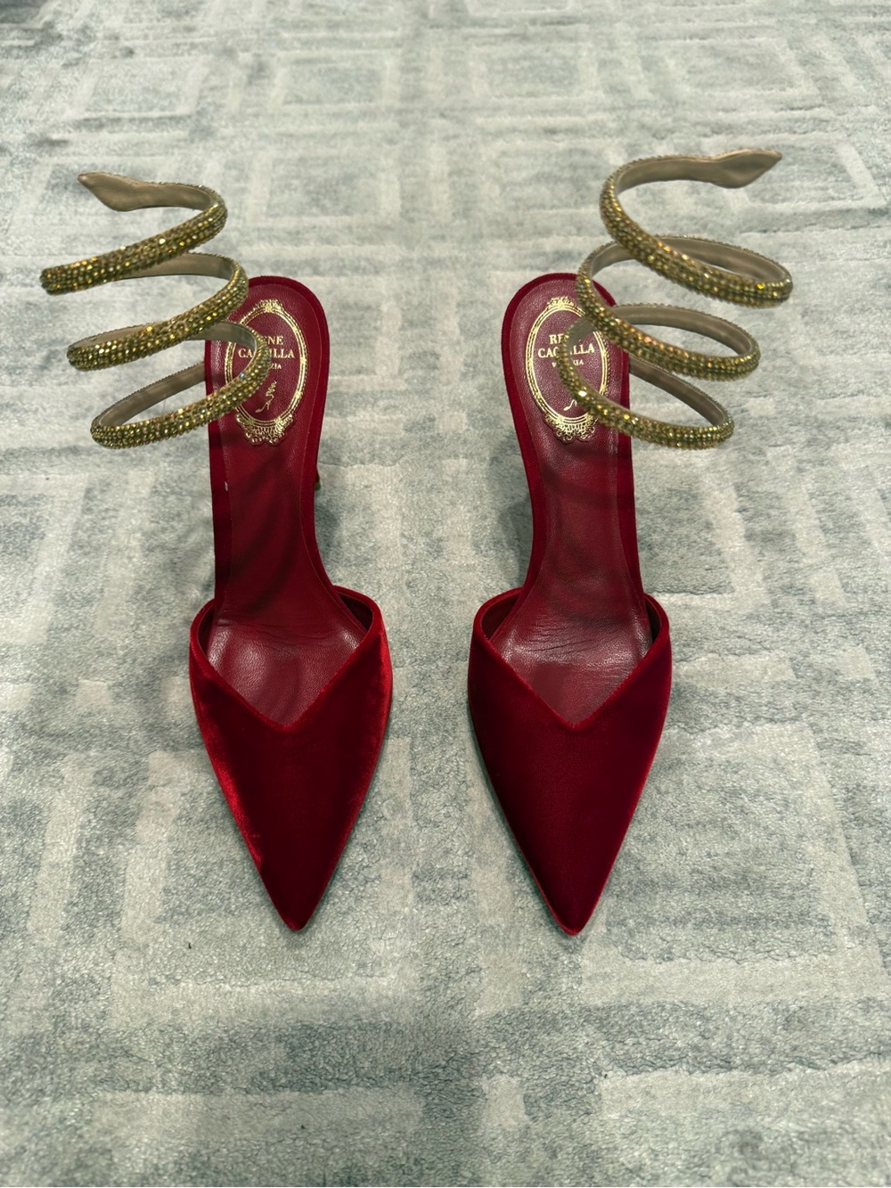 Red Velvet Pointed-Toe Heels with Gold Spiral Ankle Strap.